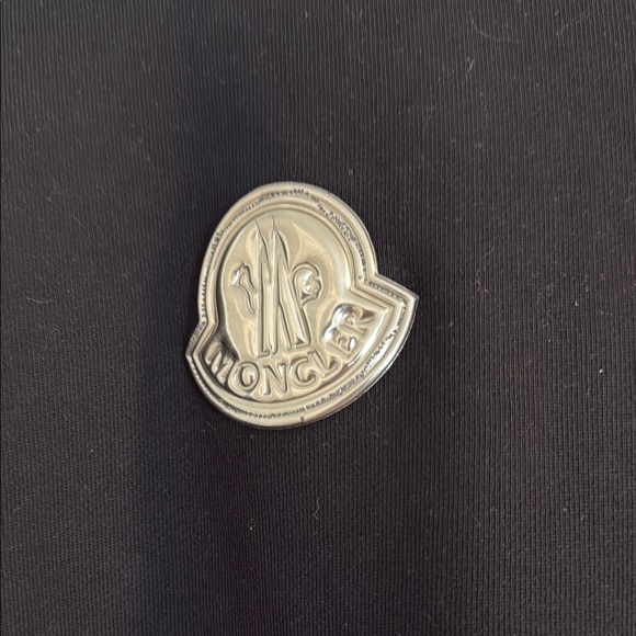 Moncler Black Outerwear with Silver Emblem
